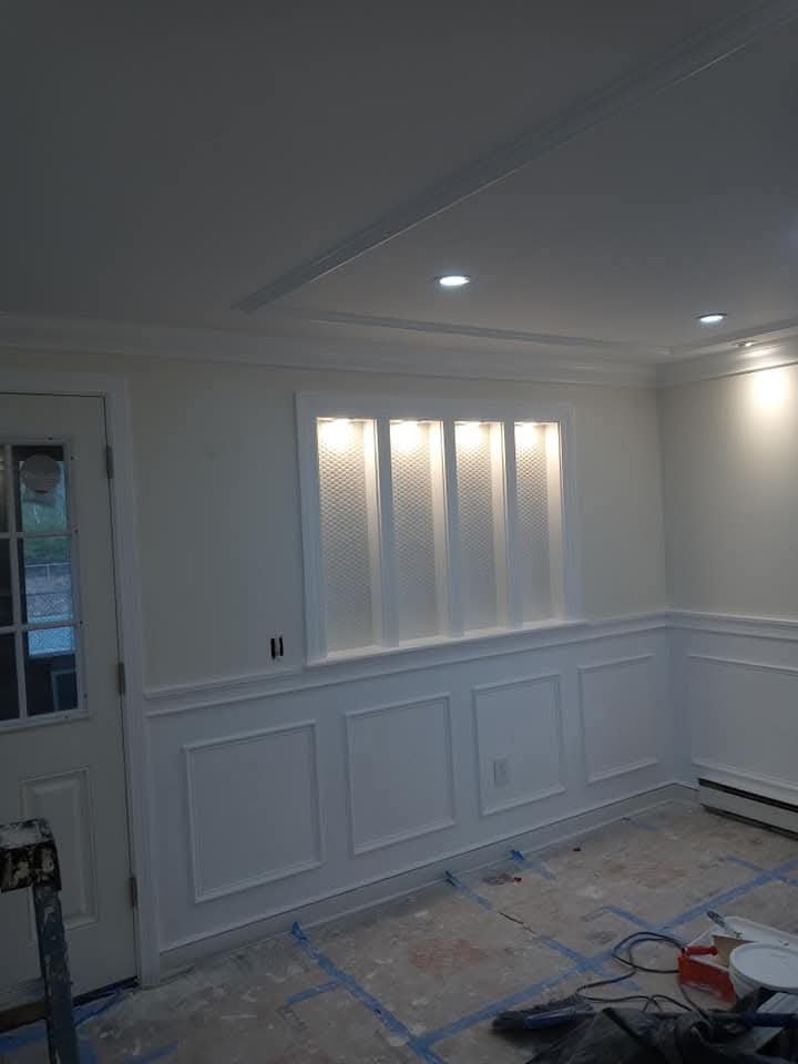 Paneled wall with lit built-in niche