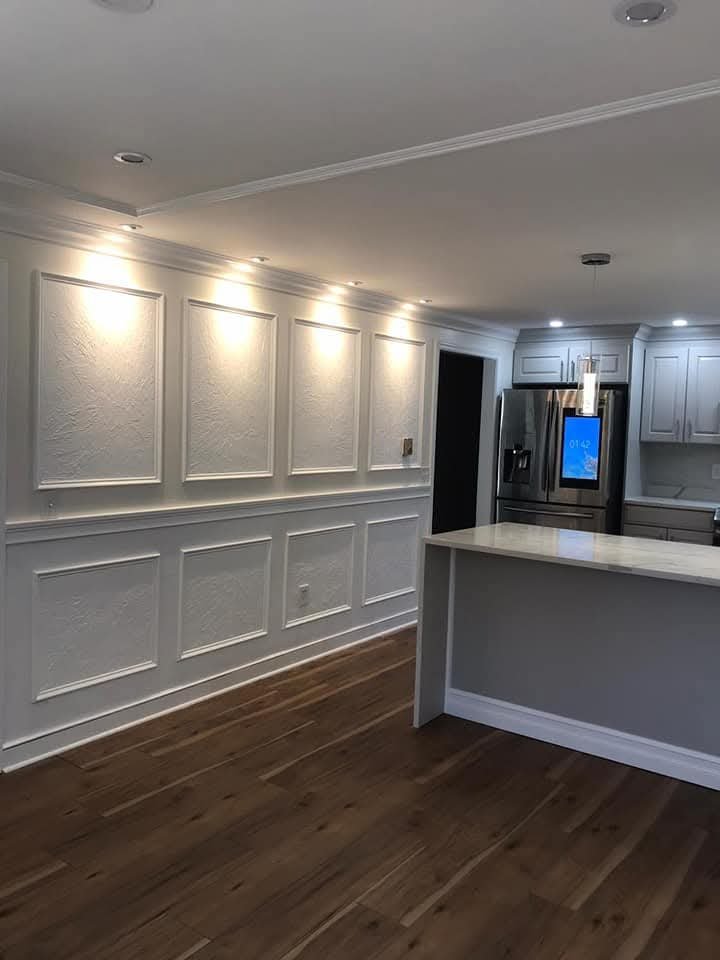 Finished dining area with custom wall paneling